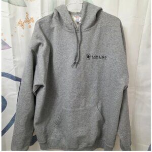 A Grey Lansing building product hoodie w/pockets.
